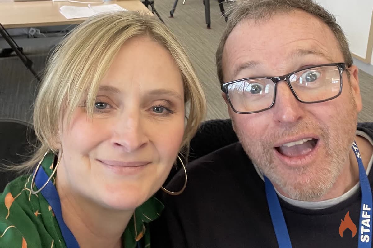 Felicity and a crew member smiling in a behind-the-scenes selfie